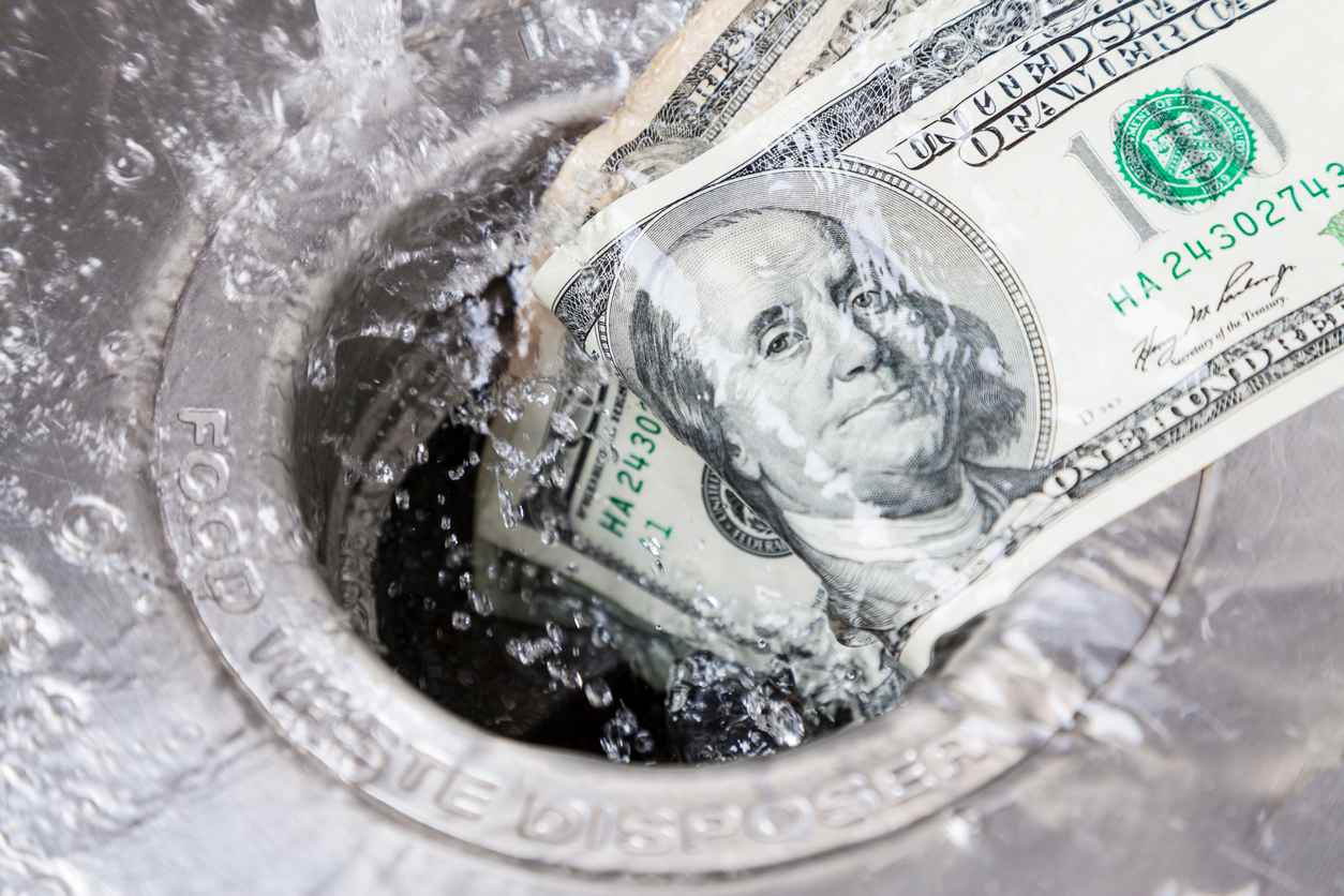 Money being washed down drain