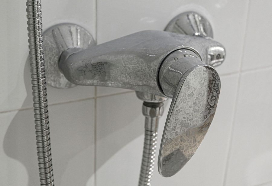 hard water & limescale stained shower handle