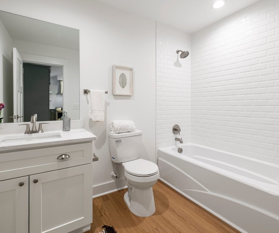Modern updated bathroom with newly installed toilet